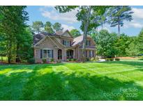 Charming two-story home with a combination of brick and stone exterior and well-manicured lawn at 303 Ridge Reserve Dr # 29, Clover, SC 29710