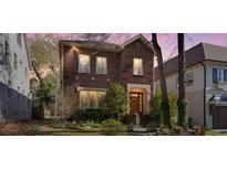 Charming two-story brick home with a well-maintained lawn and inviting entrance at 732 Ellsworth Rd, Charlotte, NC 28211