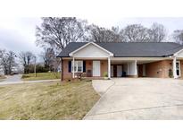 Charming single-story home with brick facade, carport, and well-maintained lawn at 110 Balsam Dr, Lincolnton, NC 28092