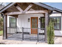 Inviting front porch with wood beam supports and railing offers a cozy entrance to the home at 1331 14Th Ne St, Hickory, NC 28601