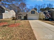 Charming single-Gathering home with a well-maintained lawn and long driveway at 1419 Deer Forest Dr, Fort Mill, SC 29707