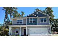 Charming two-story home featuring a covered entryway and a two-car garage at 149 High Rock Ct # 02, Statesville, NC 28677