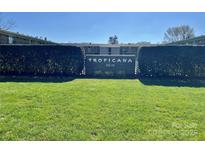 Exterior shot of the community sign surrounded by a green lawn at 3010 Crosby Rd # 122, Charlotte, NC 28211