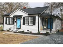 Charming single-story home with a blue front door and newly landscaped yard at 407 E Talleyrand St, Monroe, NC 28112