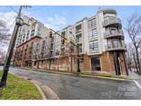 Modern building with balconies and brick accents on a street corner at 525 E 6Th St # 211, Charlotte, NC 28202