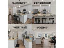 This kitchen has white cabinets, a spacious pantry, new pendant lights, and tons of storage at 6450 Keeton Ln, Harrisburg, NC 28075