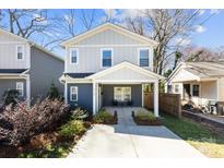 Charming two-story home featuring a welcoming front porch and beautifully landscaped front yard at 4114 Rutgers Ave, Charlotte, NC 28206