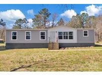 Charming single-story home with gray siding, white trim, and inviting front porch at 1317 Liberty Rd, Chester, SC 29706