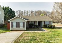 Charming single-story home with a well-maintained lawn and inviting curb appeal at 134 Chere Helen Dr, Mooresville, NC 28115