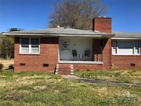 Charming brick home with a cozy front porch and inviting curb appeal at 1606 Mt Gallant Rd, Rock Hill, SC 29732