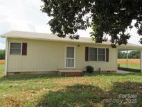 Charming single-story home featuring red shutters and covered parking, nestled in a peaceful neighborhood at 4611 Hickory Lincolnton Hwy, Newton, NC 28658