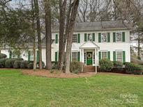 Charming two-story home with green shutters and a well-manicured front yard at 10519 Annalexa Ln, Charlotte, NC 28277