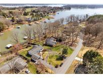 Expansive aerial view of waterfront homes on Lake Norman, showcasing lake access and mature trees at 5064 Lynwood Rd, Sherrills Ford, NC 28673