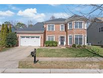 Charming brick home with well-manicured lawn, two-car garage, and neatly trimmed shrubbery at 8504 Soaring Eagle Ln, Waxhaw, NC 28173
