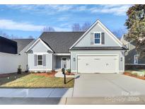 Charming single-Gathering home featuring a two-car garage and beautifully landscaped front yard at 1157 Bunch Dr, Statesville, NC 28677