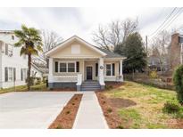 Charming single-story home featuring a welcoming front porch, fresh landscaping, and a concrete driveway at 218 Congress N St, York, SC 29745