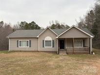 Charming single-story home with neutral siding, grey shutters, a cozy porch, and a well-maintained yard at 3195 Reservation Rd, Rock Hill, SC 29730
