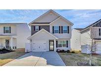 Charming two-story home with a well-manicured lawn and attached garage at 508 Hawley St, Charlotte, NC 28214