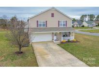 Charming two-story home with a well-manicured lawn and inviting front porch at 552 Montgomery Dr, Rock Hill, SC 29732