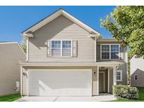 Charming two-story home featuring a front-facing two car garage, manicured lawn, and classic curb appeal at 1471 Andora Dr, Rock Hill, SC 29732