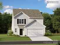 Charming two-story home with attached two-car garage, and a welcoming front yard and craftsman style details at 2461 Trollinger Dr, Catawba, NC 28609