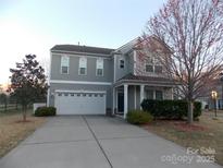 Charming two-story home features a two-car garage and well-manicured landscaping in a desirable neighborhood at 3500 Exbury Gardens Dr, Waxhaw, NC 28173