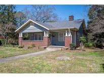 Charming single Gathering home with a brick foundation, covered porch and inviting curb appeal at 634 Carolina Ave, Gastonia, NC 28052