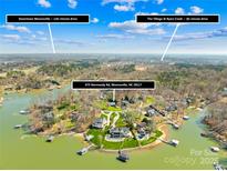 Breathtaking aerial shot of waterfront property highlighting proximity to downtown and lake access at 675 Normandy Rd, Mooresville, NC 28117