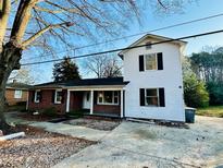 Two-story home with brick and vinyl siding, front porch and driveway at 314 N Little Texas Rd, Kannapolis, NC 28083