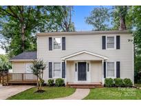 Charming two-story home featuring classic architectural details and a well-manicured lawn at 570 Scaleybark Rd, Rock Hill, SC 29732