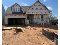 New construction home featuring a classic two-story design ready to be customized with modern finishes at 121 N Prestwick Way # 43, Mooresville, NC 28115
