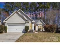 Charming single-Gathering home featuring a well-maintained front yard and a two-car attached garage at 12810 English Walnut Ln, Charlotte, NC 28215
