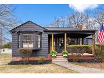 Charming single-story home featuring a covered front porch, brick accents, and neatly trimmed landscaping at 212 Sloan St, Belmont, NC 28012