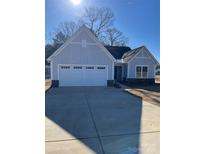 Charming one-story home with attached garage and welcoming entrance at 2358 Fay Jones Rd, Denver, NC 28037