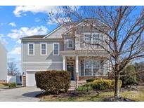 Charming two-story home with gray siding, landscaped front yard, and inviting front porch at 3708 Cashew Way, Rock Hill, SC 29732