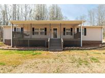 Charming single-story home featuring a welcoming front porch and neatly landscaped yard at 4604 Karwood Dr, Rock Hill, SC 29732