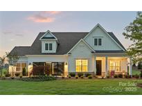 Charming two-story home with well-manicured lawn and inviting front porch at 5312 Allburn Pkwy, Concord, NC 28027