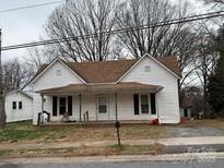 Charming two-story home with a covered front porch and a quaint, traditional design at 630 N Davis Ave, Newton, NC 28658