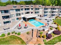 Beautiful in-ground pool on a manicured lawn at the condo community at 7831 Spinnaker Bay Dr # 106, Sherrills Ford, NC 28673