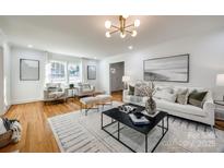 Bright living room features hardwood floors, contemporary decor, and plenty of natural light at 1081 Evergreen Cir, Rock Hill, SC 29732