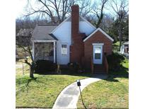 Charming home featuring a brick facade, a cozy porch, and a well-manicured lawn at 109 Oakland Ave, Chester, SC 29706