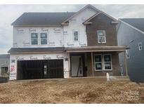 Two-story house with brick and siding exterior, covered front porch, and two car garage at 166 Holsworthy Dr, Mooresville, NC 28115
