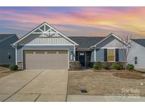 Charming single-Gathering home featuring a two-car garage and well-maintained landscaping at 4317 Stream Dale Nw Cir, Concord, NC 28027