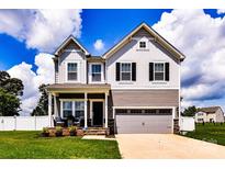 Charming two-story home with well-manicured lawn and attached two-car garage at 116 Dublin Ct, Statesville, NC 28677