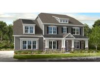 Charming two-story home showcasing a stylish facade, a covered entryway, and manicured landscaping at 14703 Keyes Meadow Way, Huntersville, NC 28078