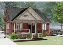 Charming red craftsman-style home with a cozy front porch and well-maintained landscaping at 810 & 812 Lincoln E St # 810, Lincolnton, NC 28092