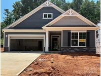 Charming single-Gathering home with a two-car garage and stone accents at 149 Prestwick Way # 39, Mooresville, NC 28115