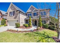 Beautiful two-story brick home with a landscaped front yard and inviting entrance at 2317 Barrington Ridge Dr, Waxhaw, NC 28173