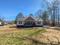 Charming one-story home with manicured lawn and inviting curb appeal, perfect for families or first-time buyers at 733 Baker St, Kannapolis, NC 28081