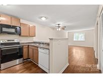Bright kitchen with stainless steel appliances, including a microwave, oven and dishwasher at 1606 Eagles Pl # J101, Rock Hill, SC 29732